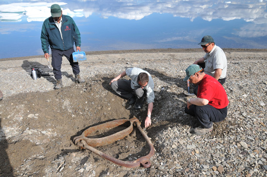 Parks Canada archaeologists excavating a rigging element from HMS Investigator