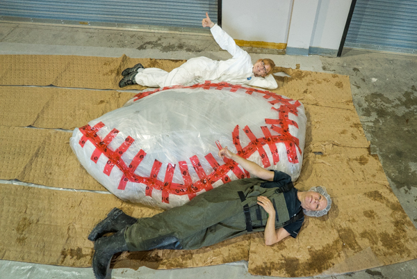 ROM research technician Jacqueline Miller and Schad Gallery Coordinator Nicole Richards pose with the wrapped blue whale heart for scale. Photo by Stacey Lee Kerr
