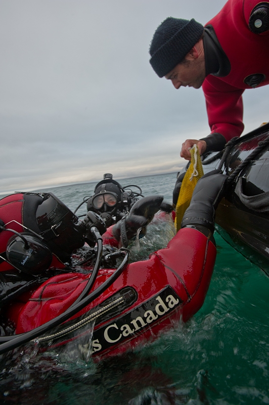Parks Canada archaeologists diving the wreck of the HMS Investigator