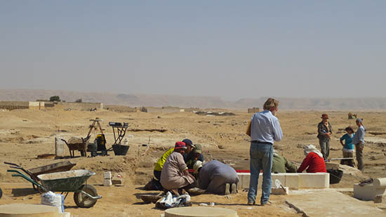 Archaeological site with team at work.