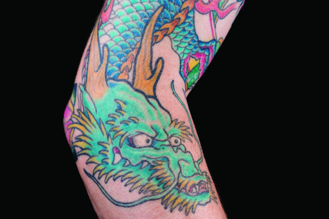 Tattoo of a Japanese styled dragon on an arm 