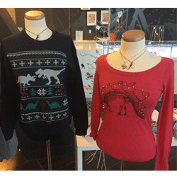 The ROM Boutique’s Playful Dino prints on an ugly holiday sweater and long sleeved shirt