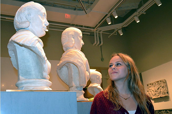 Clare Schwartzberg gazing at portrait busts