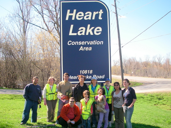 A group of people working together to protect wetlands in the Heart Lake Conservation Area