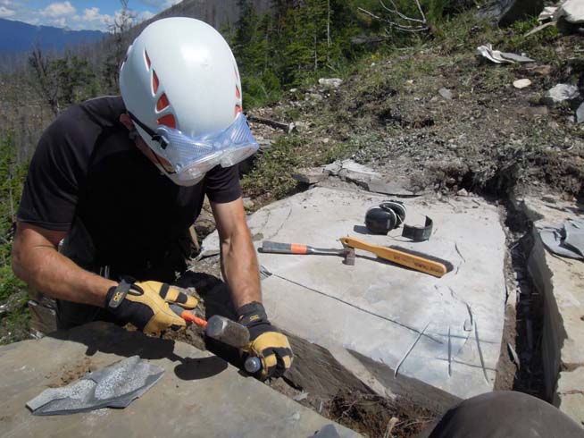 Extracting cut blocks using a hammer and chisel at the Stepehn Formation near Marble Canyon (image courtesy of Robert Gaines).