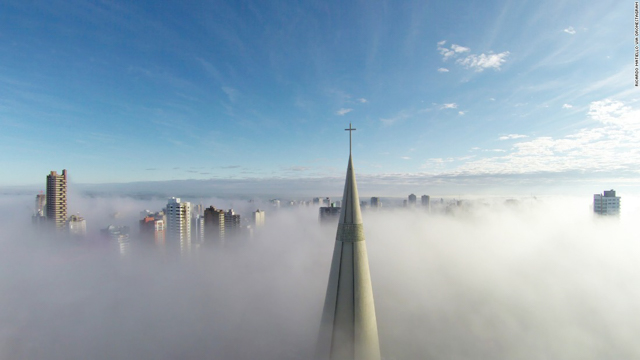 “Above the mist,” taken in Maringa, Brazil, was the most-liked photo in this year's CNN 2015 Drone Aerial Photography Contest. The photo is a view of the Brazillian city from above a blanket of fog, showing the tips of skyscrapers poking through the low-lying cloud, and the vast blue sky above. Photo by Ricardo Matiello.