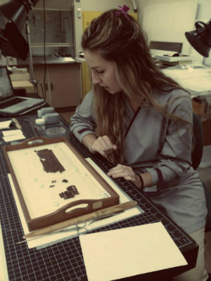Natasa Krsmanovic examining papyrus fragments in the paper conservation lab. Photo by Jaime Clifton-Ross