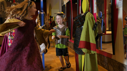 Children playing dress-up in the CIBC Discovery Gallery ROM