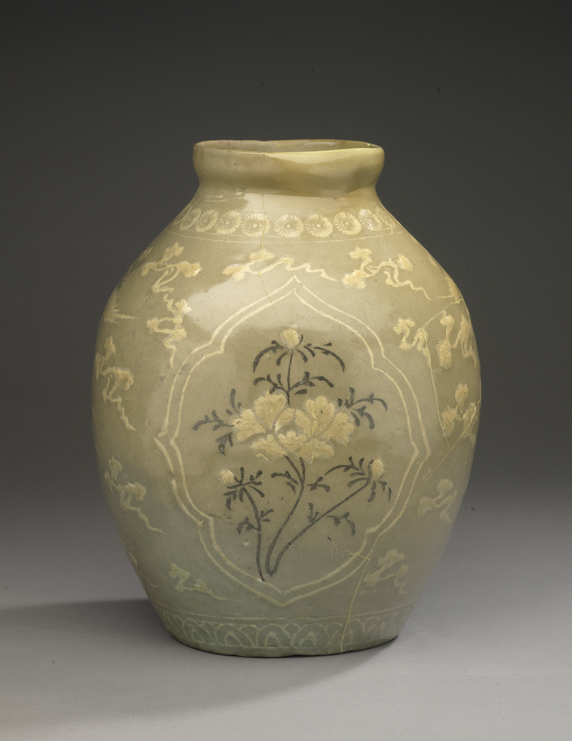 Late 13th to early 14th century Goryeo Period Celadon Jar with Inlaid Peony, Cloud, and Crane Design 청자상감 모란운학문 편호, wheel-thrown stoneware with inlaid designs under celadon glaze, Korea, 910.40.5. © ROM and Gift of Sir Edmund Walker.