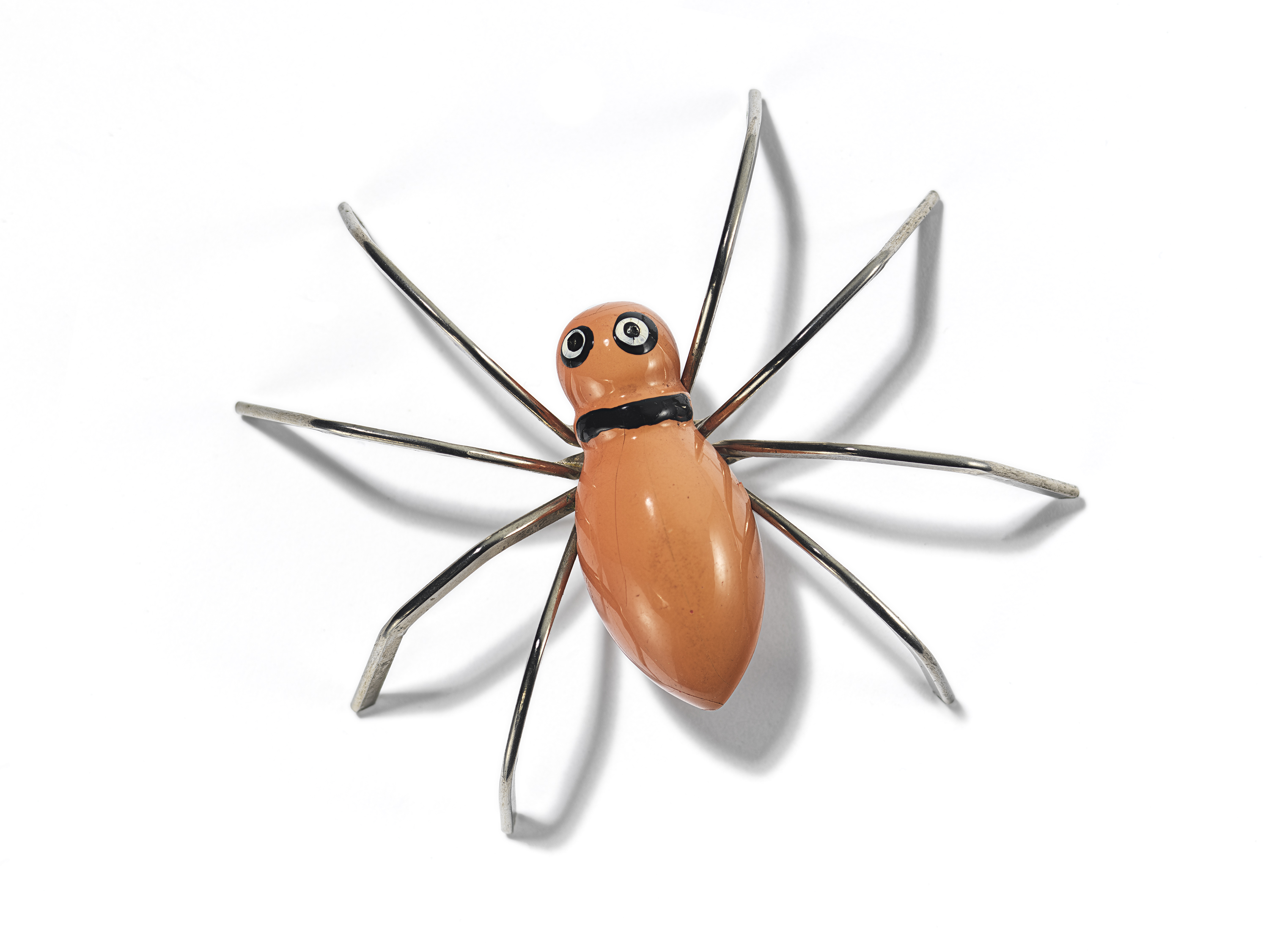 Woman's brooch of a spider, enamel on silver-toned metal, 2019.104.170. © ROM. Gift of Carole Tanenbaum.