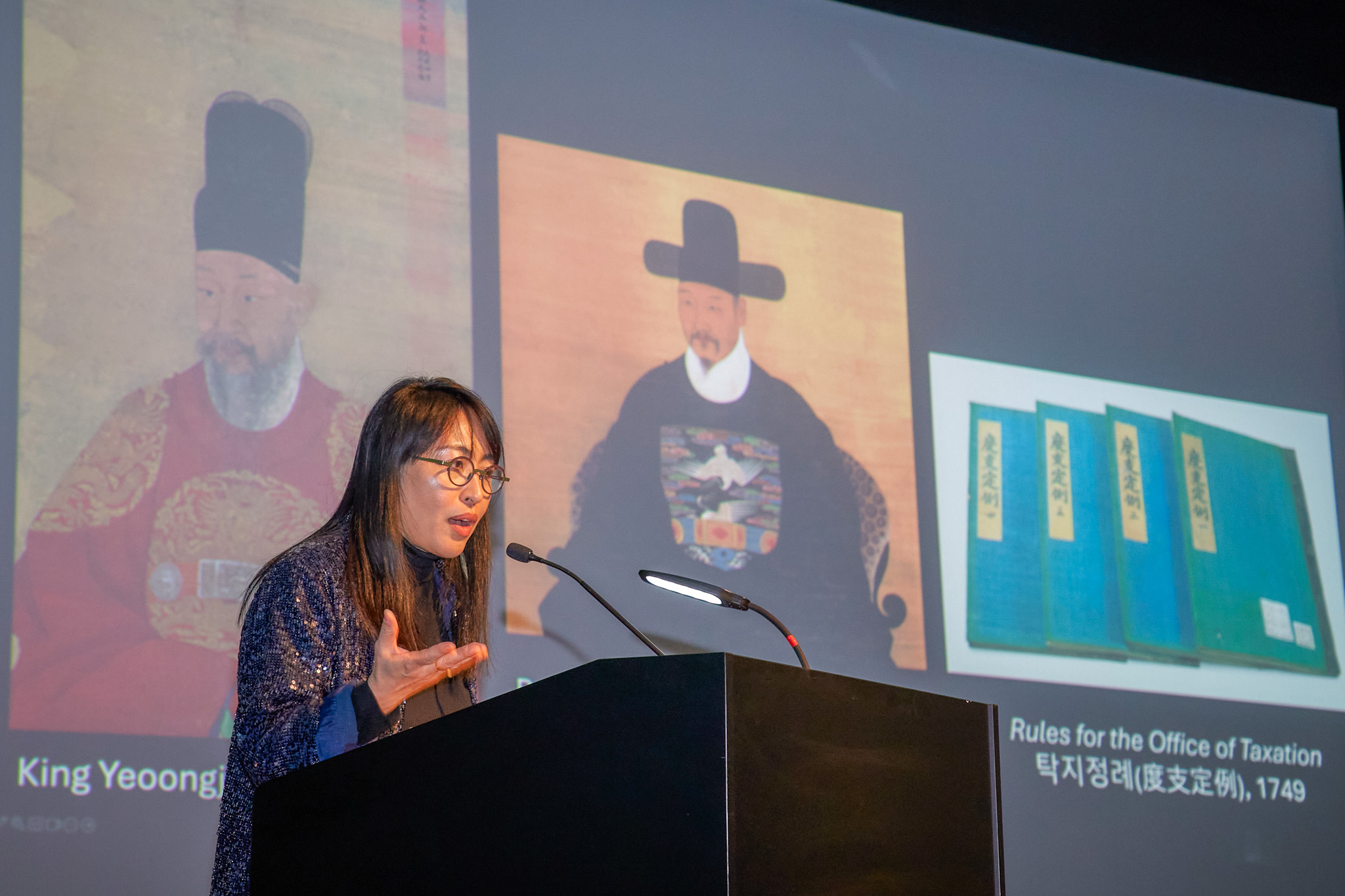 Woman speaking at podium
