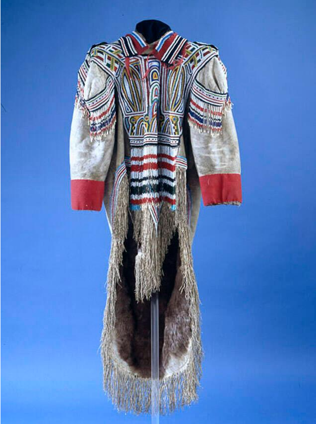 A grey caribou skin parka decorated with intricate red, black, white, and blue designs made from beads.