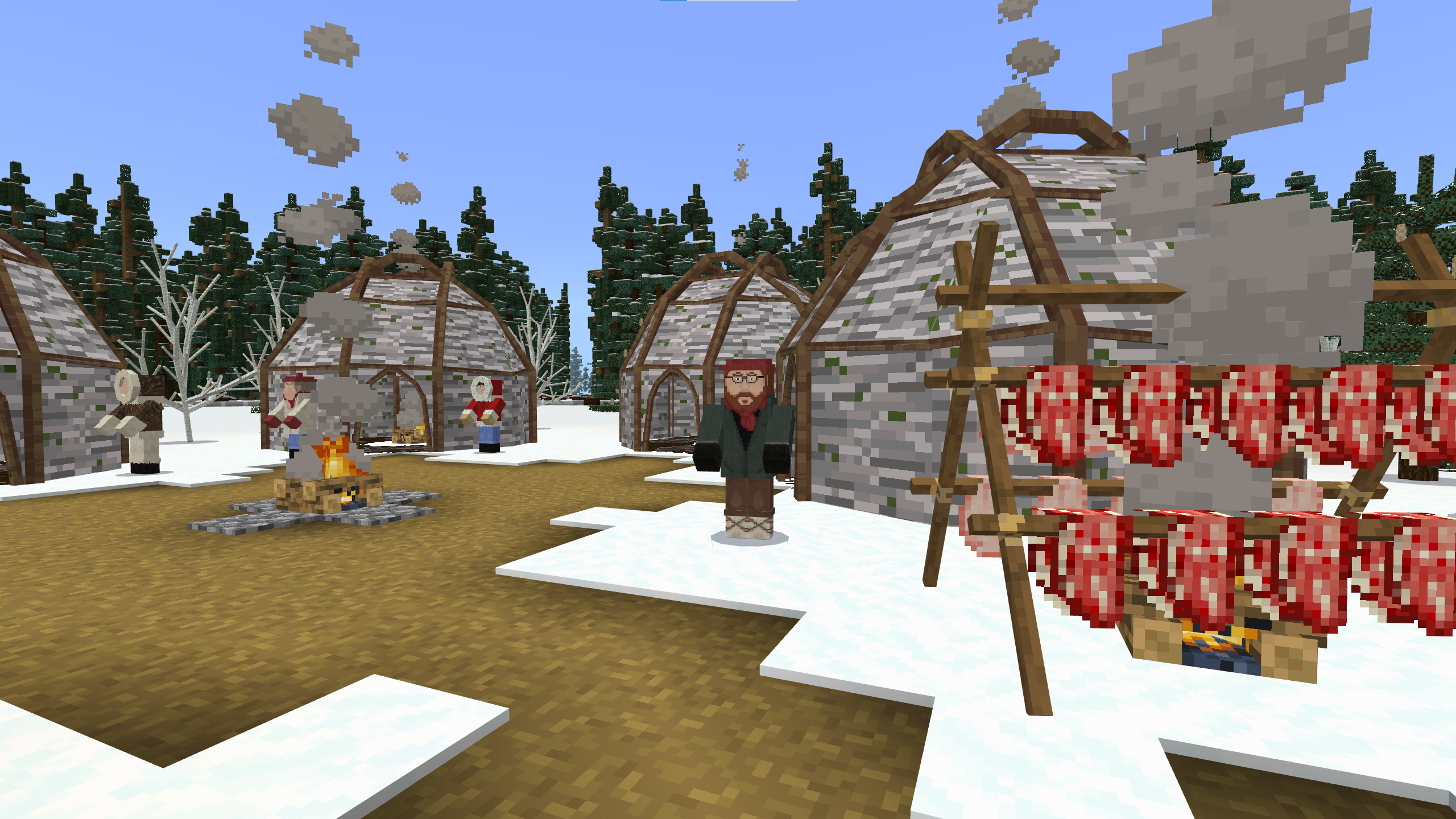 A Minecraft screenshot of a campsite in a winter forest. Several birchbark wiigwaams are set around a central fire. To one side, meat on racks cures over a fire. Several Elders dressed in warm winter clothing stand outside the wiigwaams.