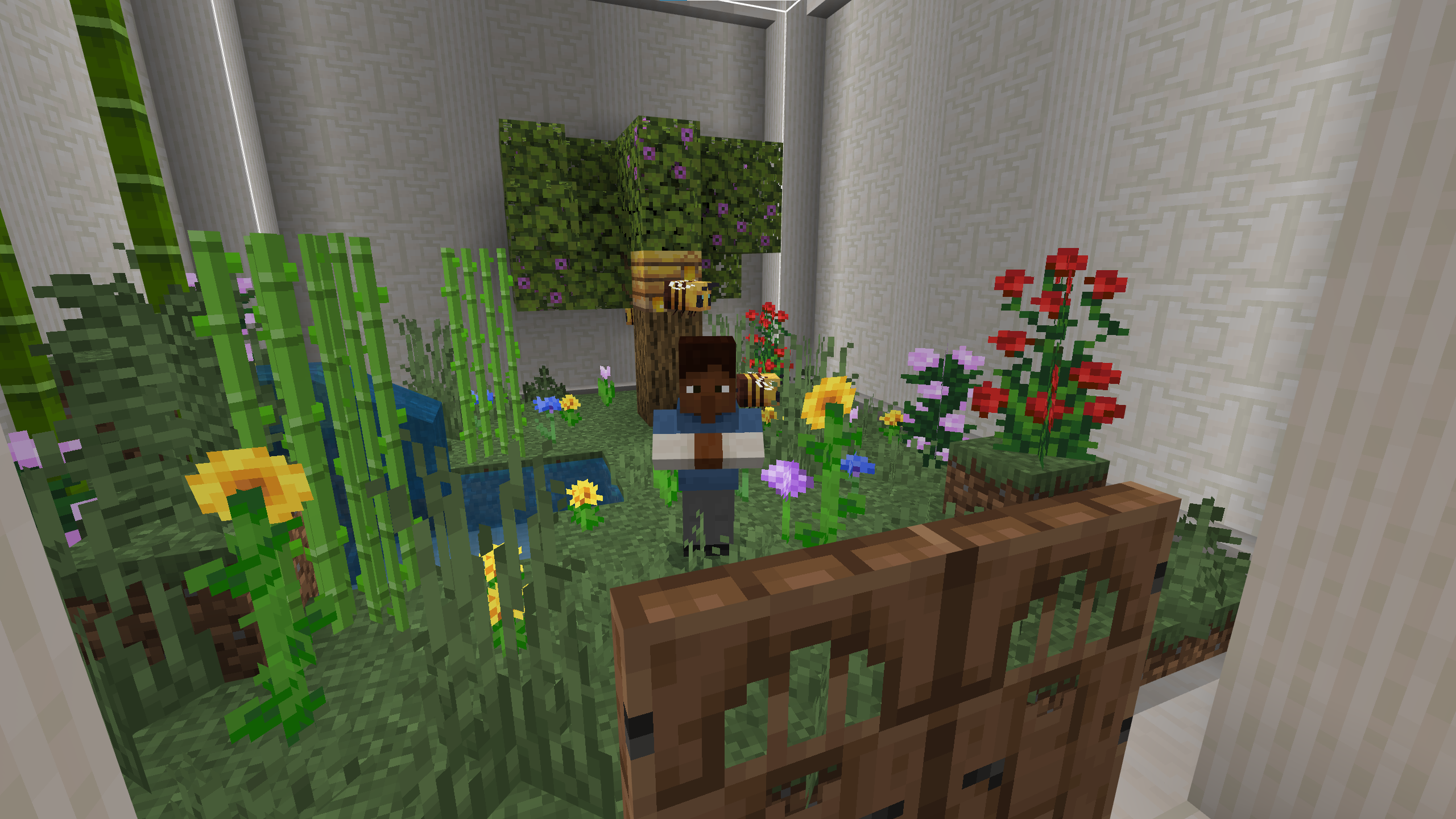 A Minecraft screenshot of a man standing in a lush garden with flowers and a beehive.
