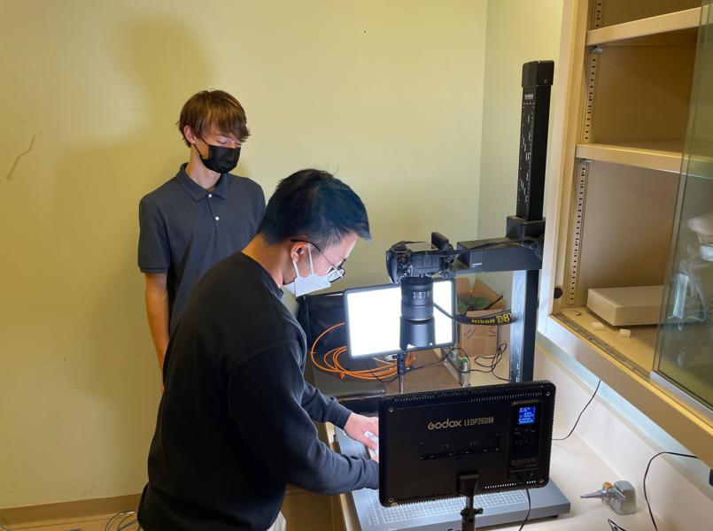 Beckett Robertson and Colin Chiu, an entomology digitization technician, set up a specimens imaging station at ROM. (2023)