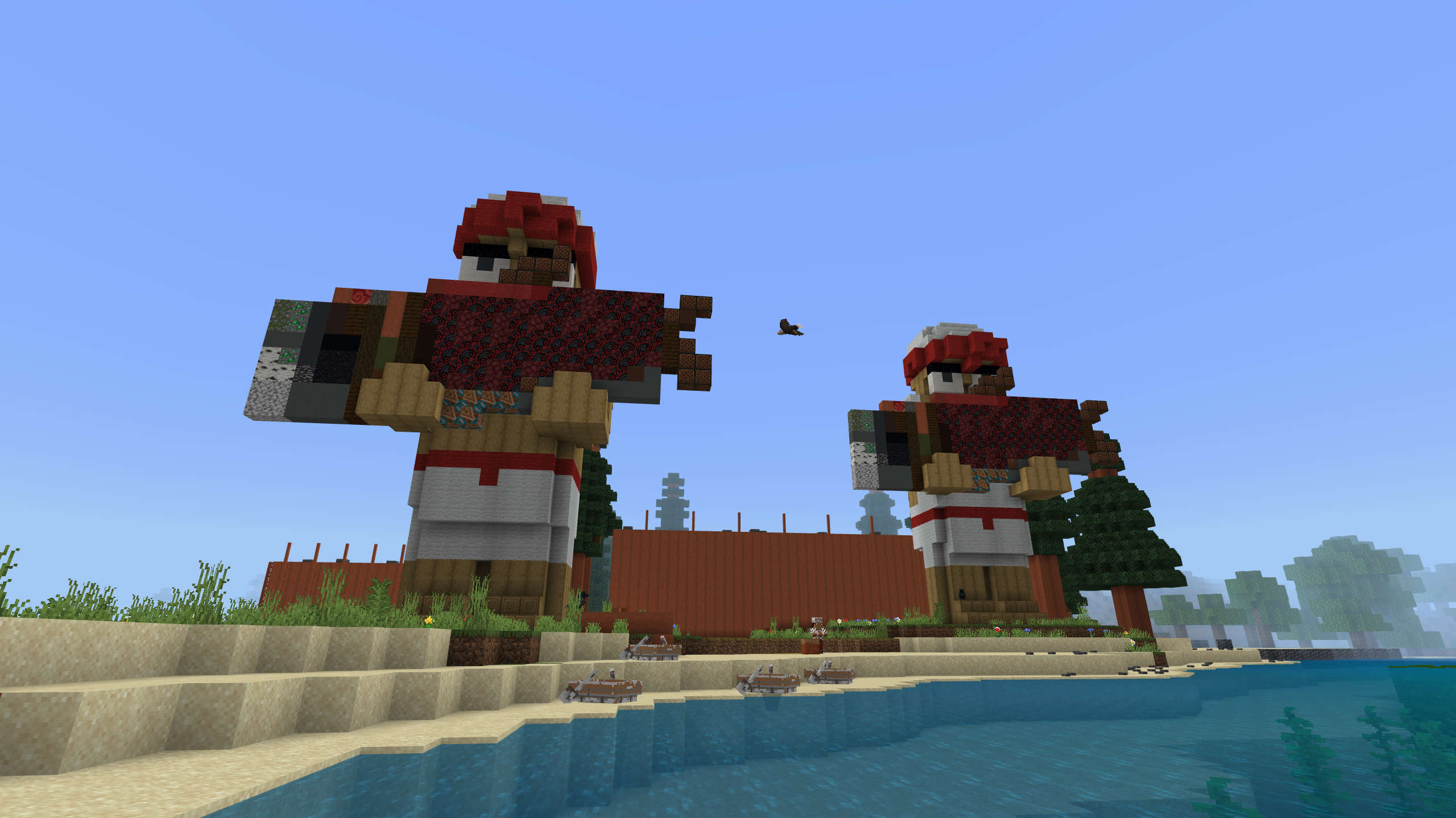 A Minecraft screenshot of two large statues holding salmon on a beach.