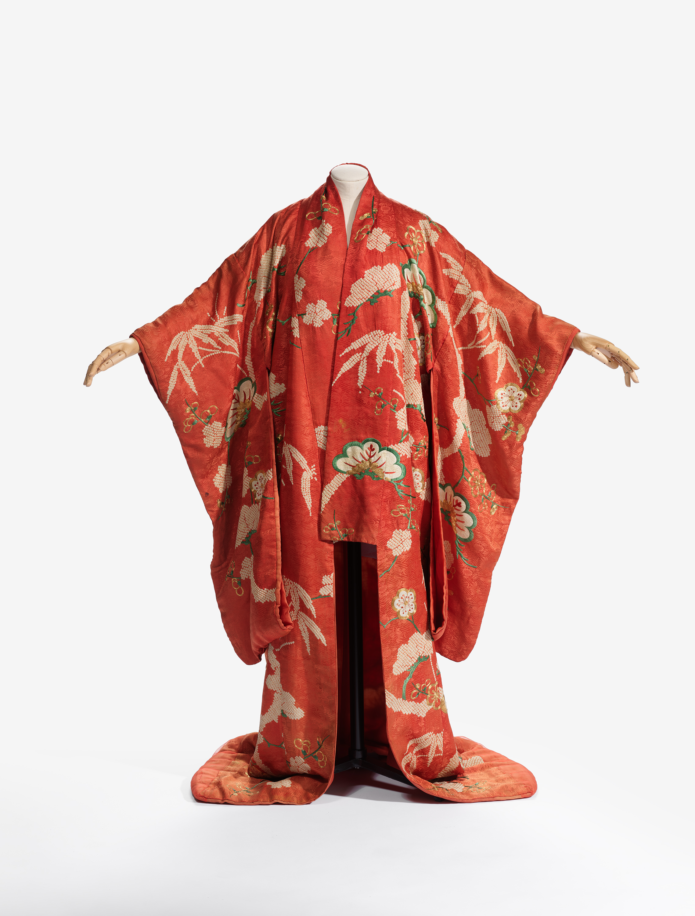 red kimono draped on mannequin 