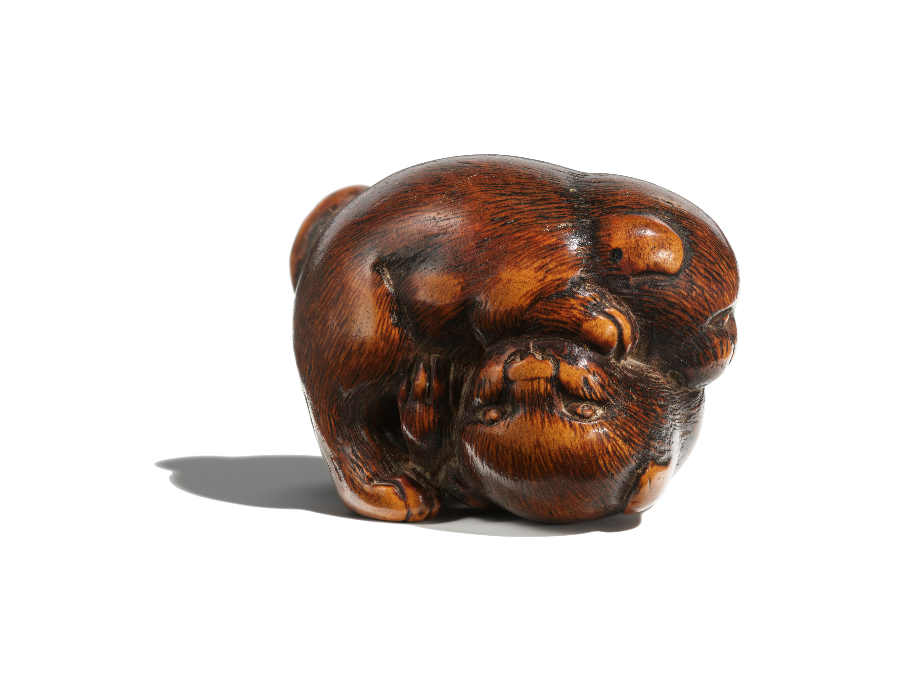 Small netsuke of two puppies