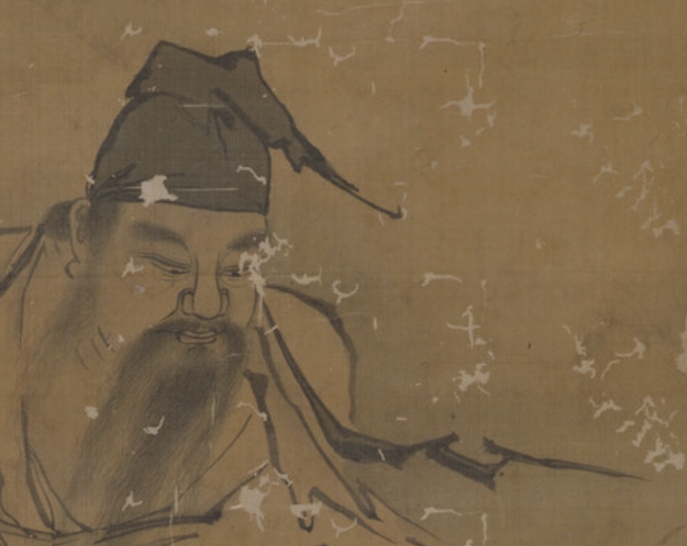 Vertical ink-and-wash painting on a tan, aged scroll. Two human figures in flowing robes are shown outdoors among grasses and rocks; one figure stands or leans forward holding long, leafy branches, while another figure crouches below with a hunched posture. The style is monochrome linework with light ink washes, visible wear, and scattered patches of abrasion across the surface.