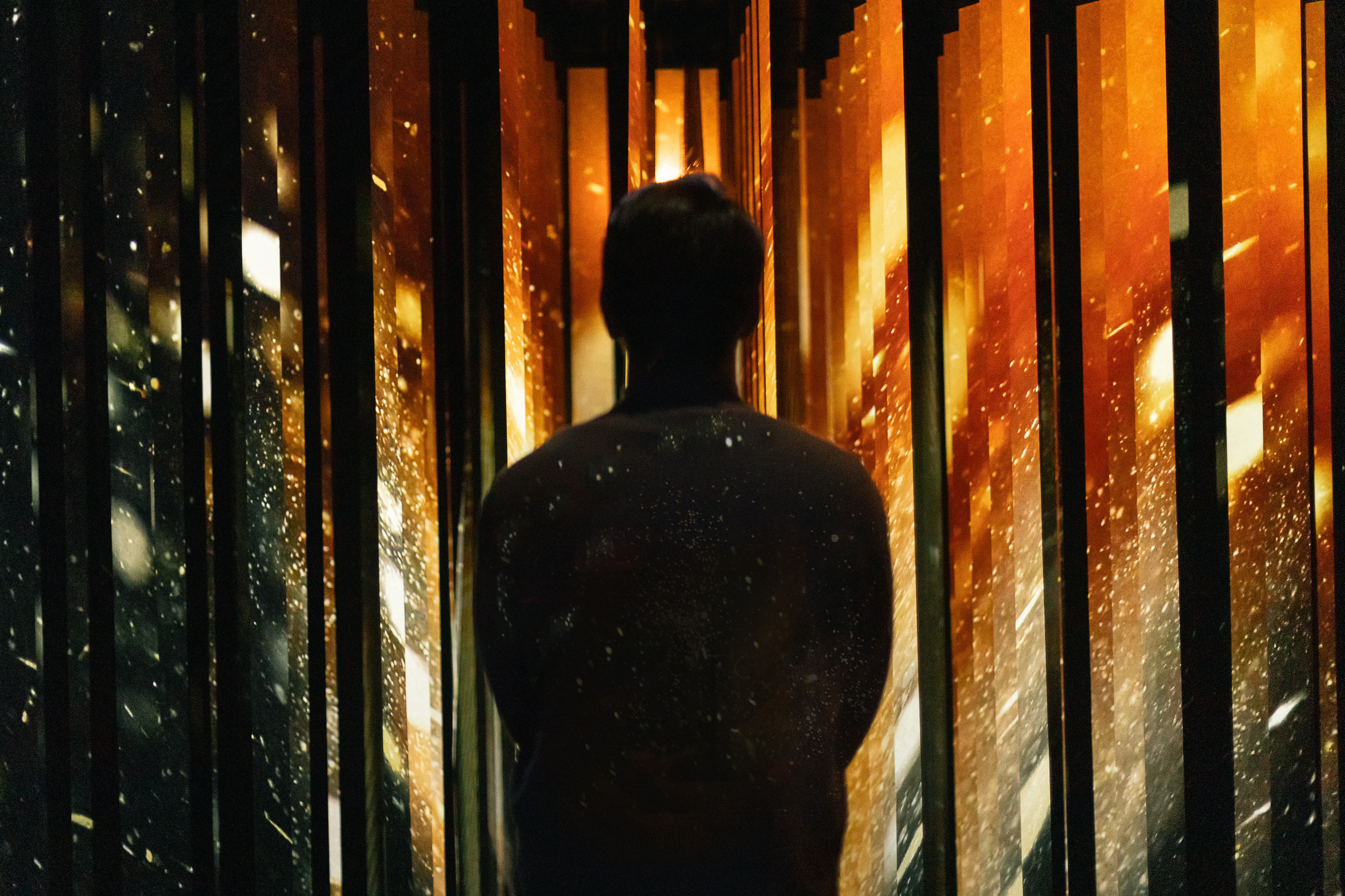 A person experiences an immersive activation in the exhibition.