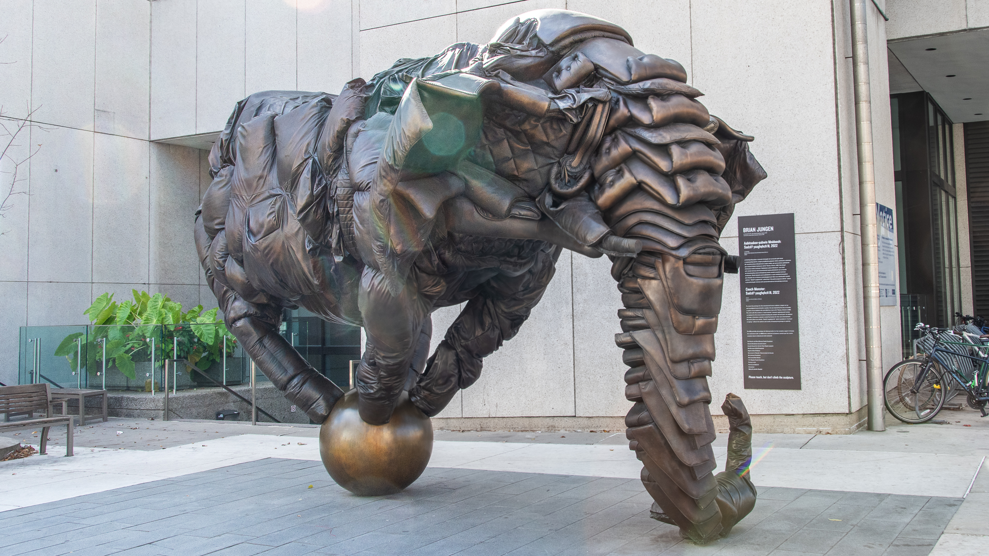 Artwork with figure balanced on a ball