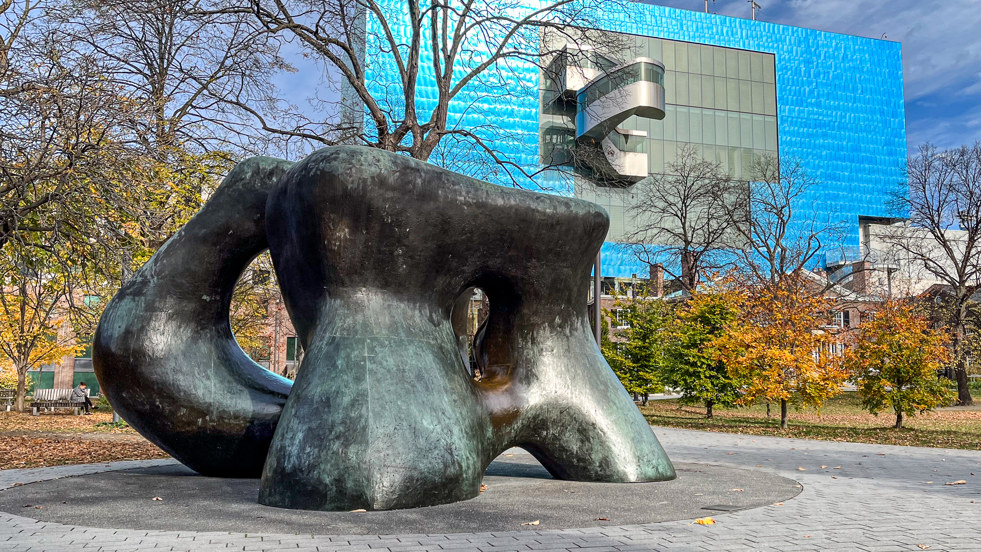 Large sculpture in foreground with building in background