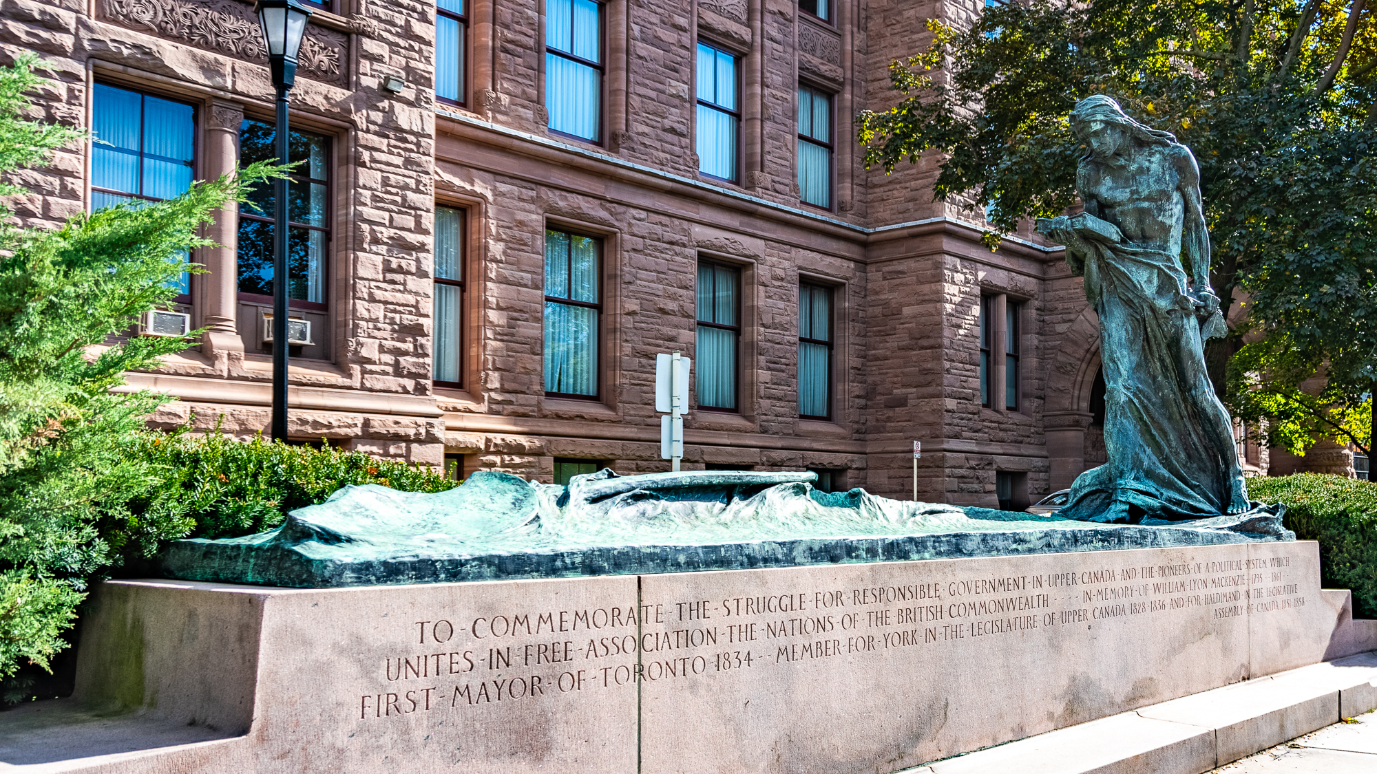 Memorial to Responsible Government in the foreground, with building in background