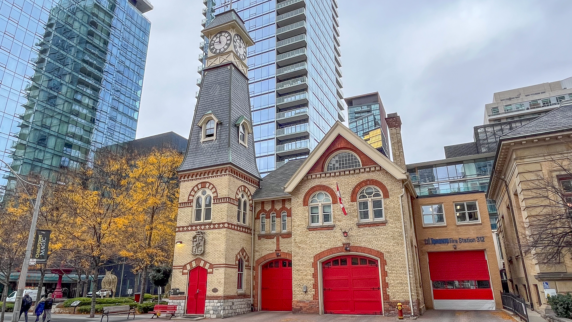 street view of firehall with red doors in foreground