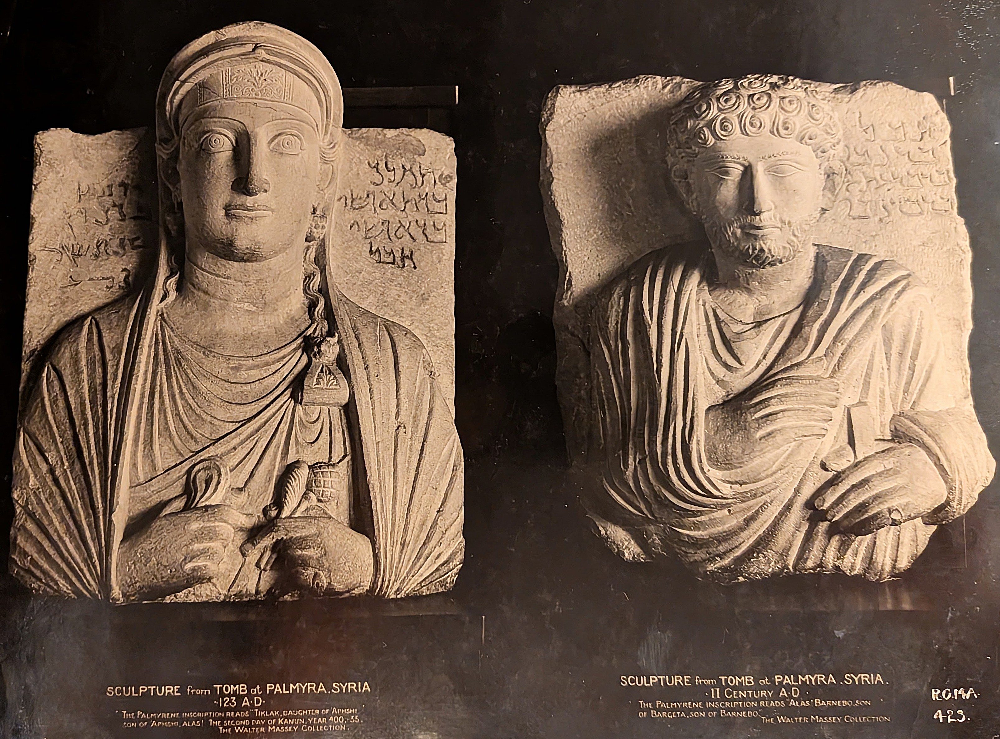 Left: Limestone stele depicting a woman with long hair and rectangular face; right: Limestone stele depicting a man with curly hair and beard, both wearing draped garments and seated.