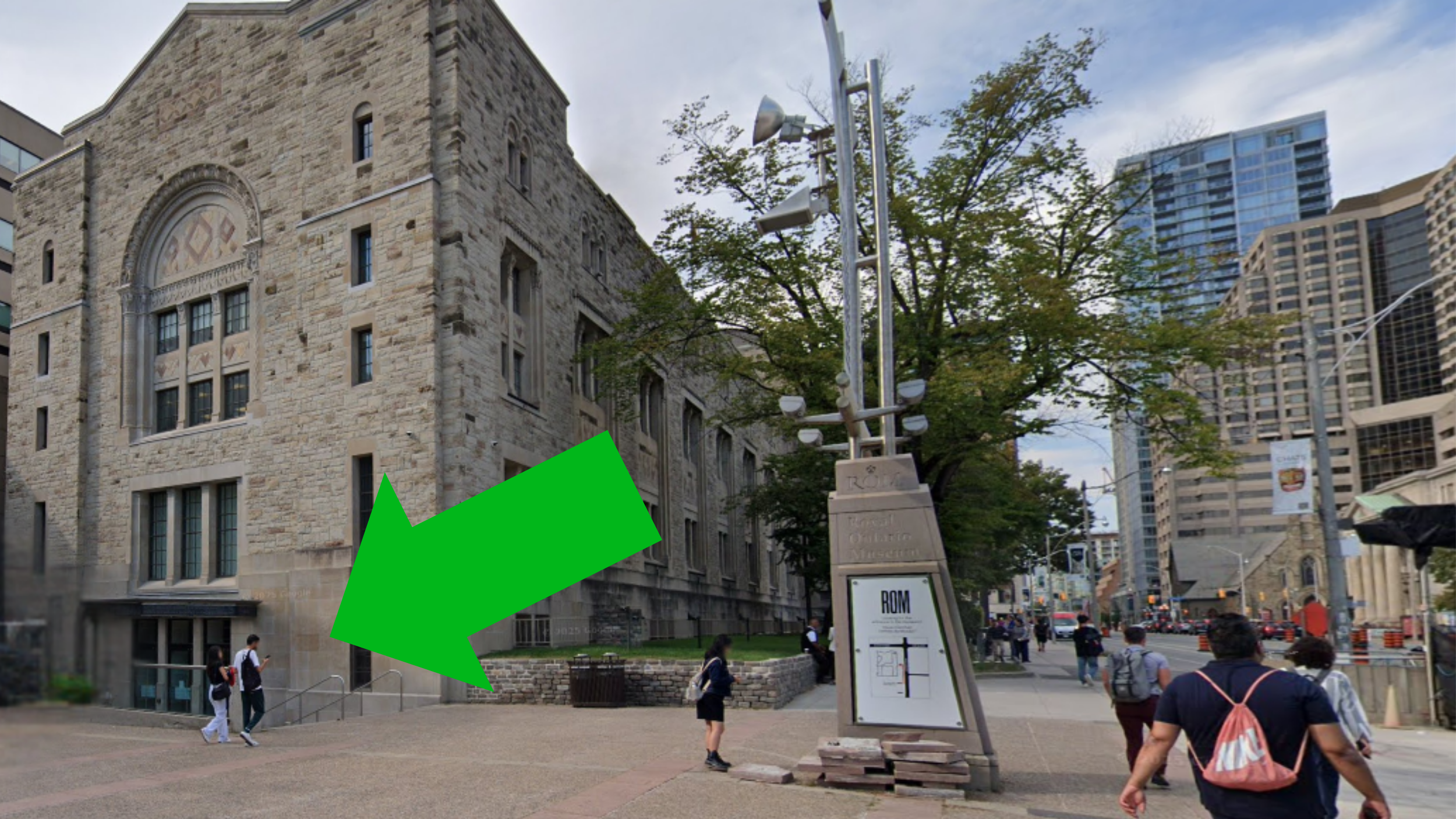 An arrow points at a door down a flight of stairs