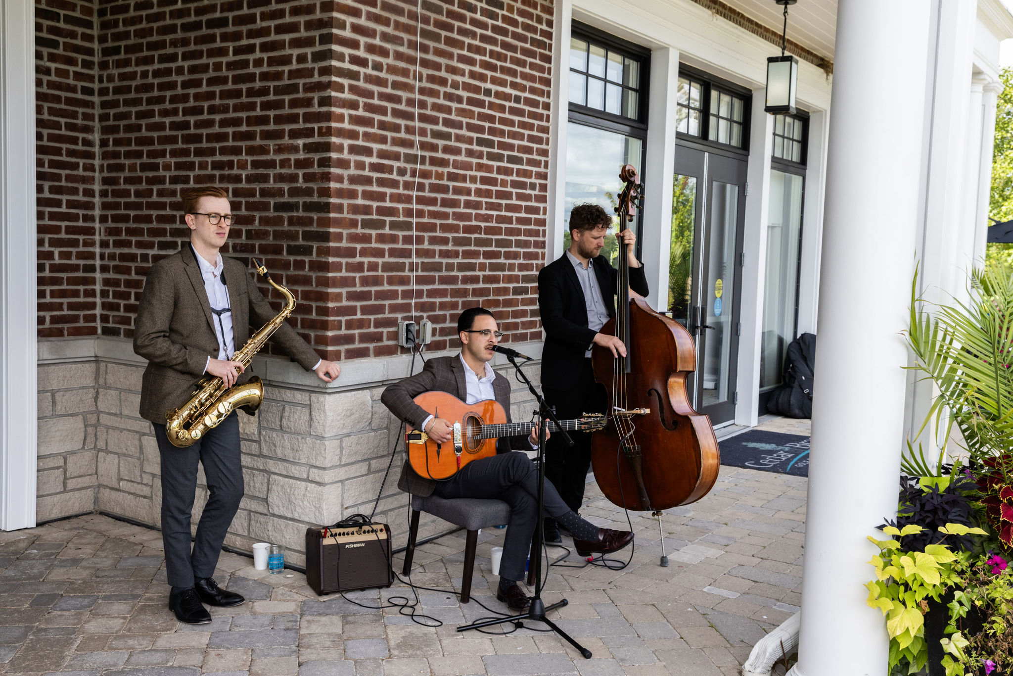 Three men musical trio playing at Cedar Brae golf club. 