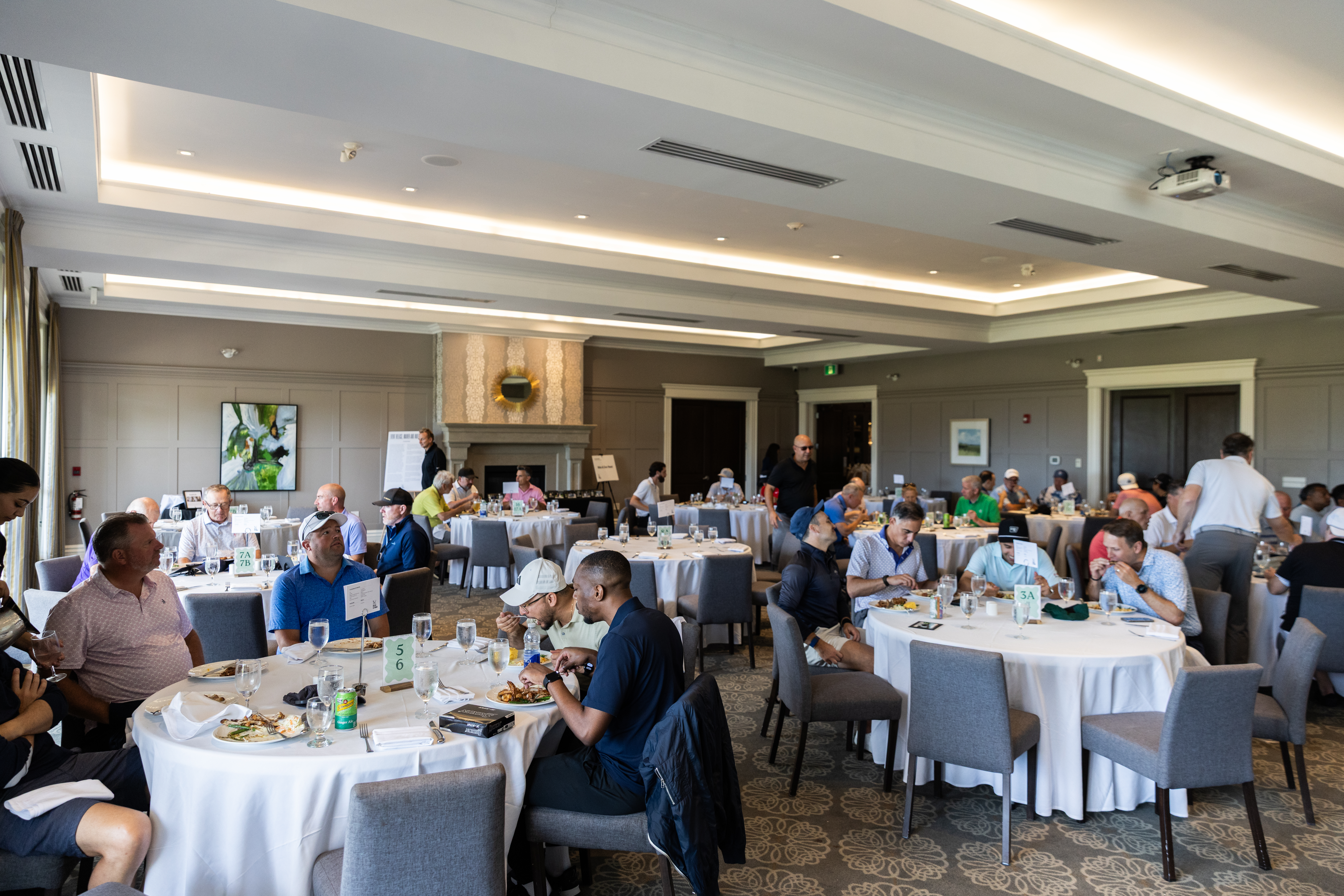Players sitting down for lunch at the reception. 