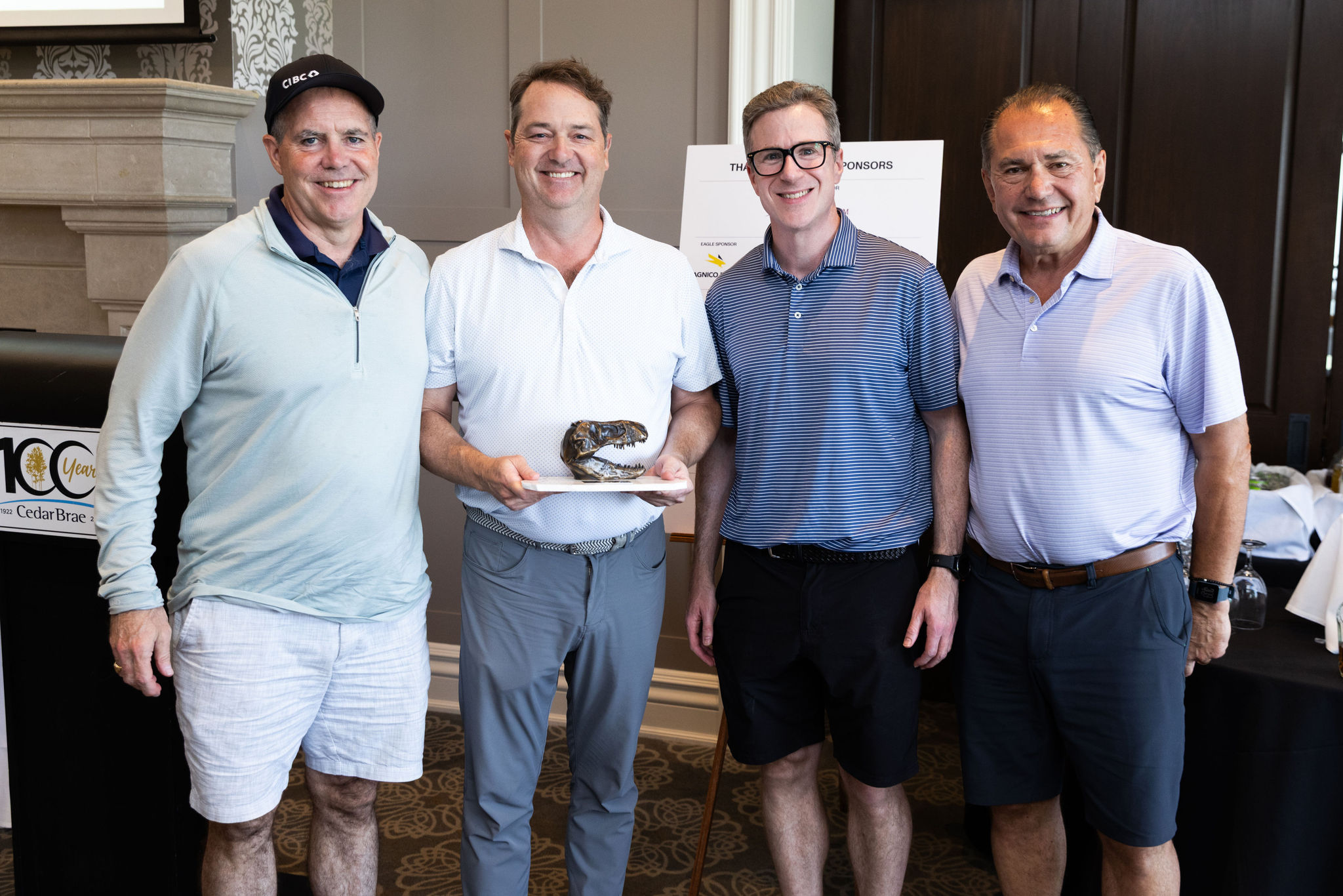 CIBC 10th Annual Driving Impact Award Winners holding the award. 