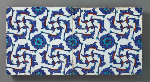 Tiles showing repeated floral and vine patterns