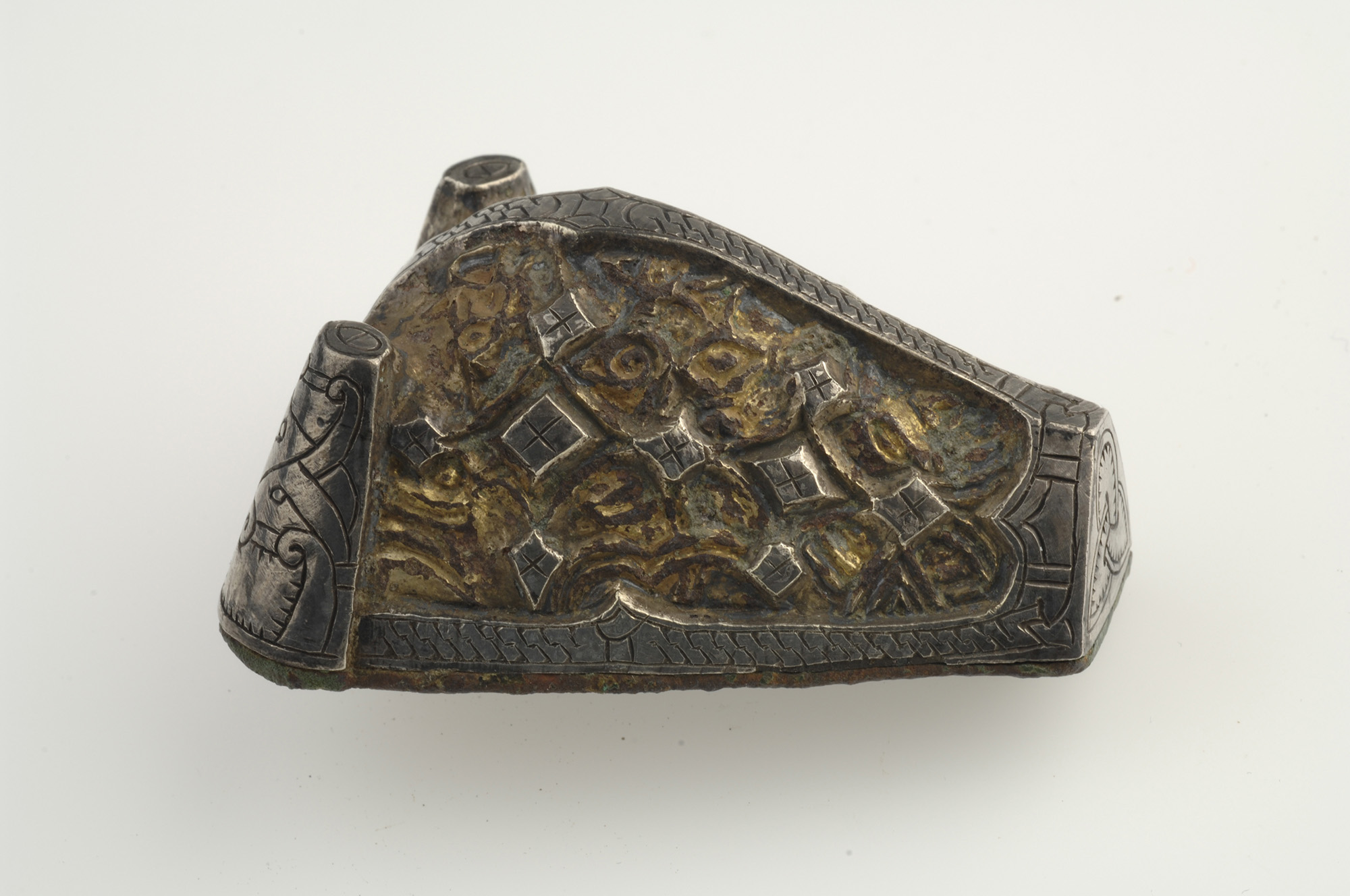 Brooch, animal-head shaped, bronze, silver and gold.