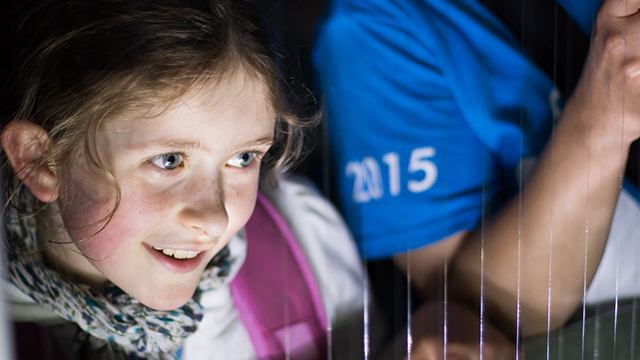 Bioblitzer Saskia looks on excitedly as her guided blitz group discovers some bats have been caught in the harp trap set up by Burton and Dan. Photo by Kendra Marjerrison