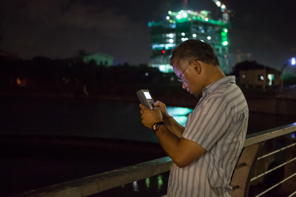 ROM Mammalogist Burton Lim listens with a bat detector for echolocation calls on the first night in Columbo, Sri Lanka. Photo by Vincent Luk