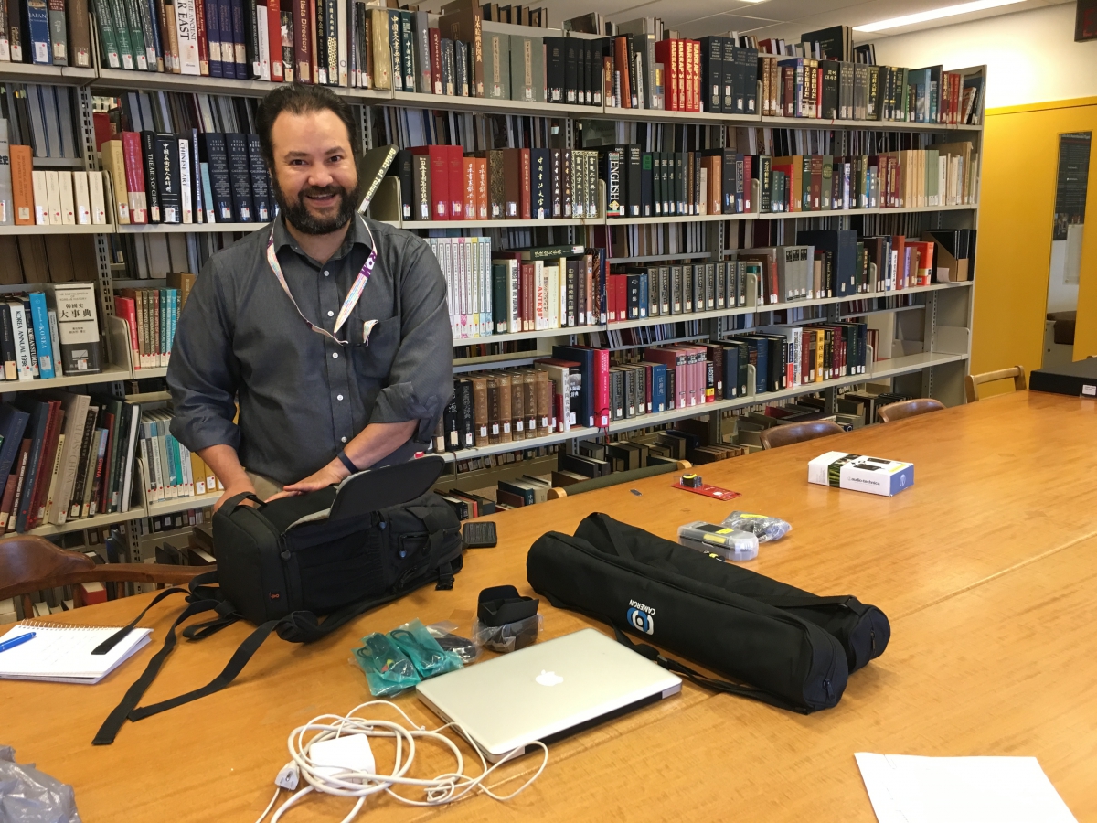 Videographer Celio Barreto with equipment, The Royal Ontario Museum (Photo: D. Dewan, 2016) intern with cameras