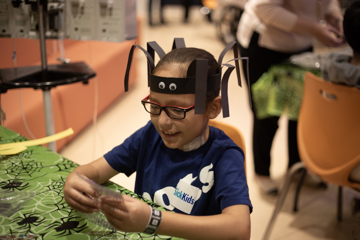Photo by Karissa Chandrakate @pangea1010 A child a the Hospital for Sick Children engages in a spider craft.
