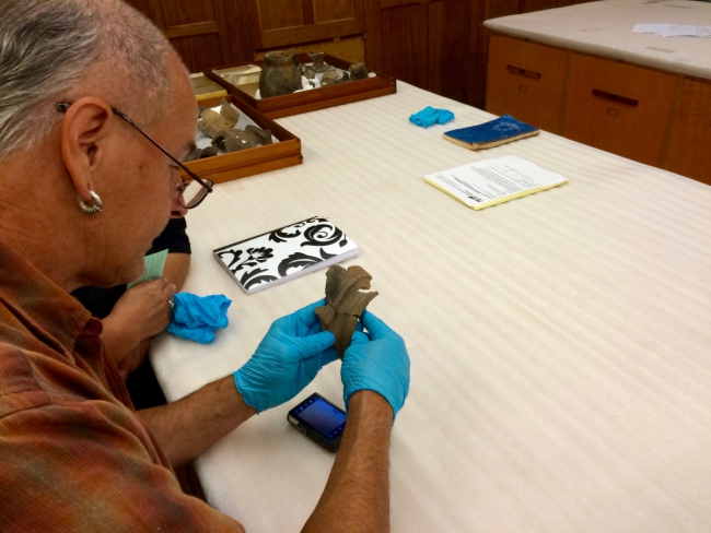 Richard and Catherine examine ceramics made by their Ancestors