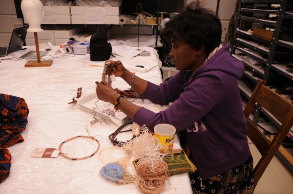 Caroline reparing a broken necklace