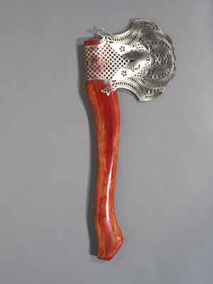 Ruth Abernethy (Canadian, 1960 – ) The Canadiana Collection - “Canadiana #1” 2005-2007 Laser-cut 18-gauge stainless steel, hand-carved spruce handle with red acrylic paint 2009.31.1© CARCC, 2013