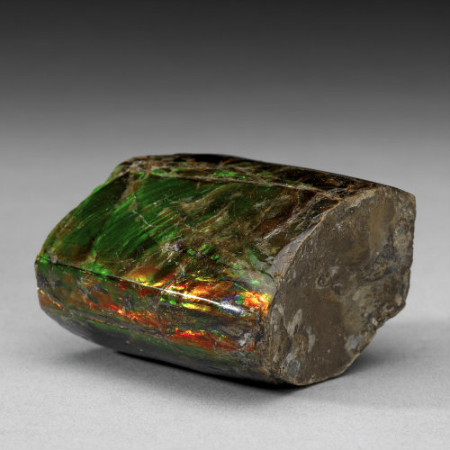 Green exposed inside the cut. The exterior of the specimen is rusty brown. Quartz variety chrysoprase