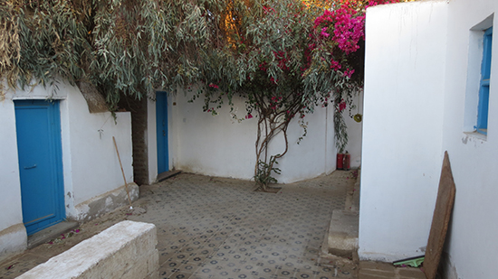 A courtyard with a mosaic floor. 