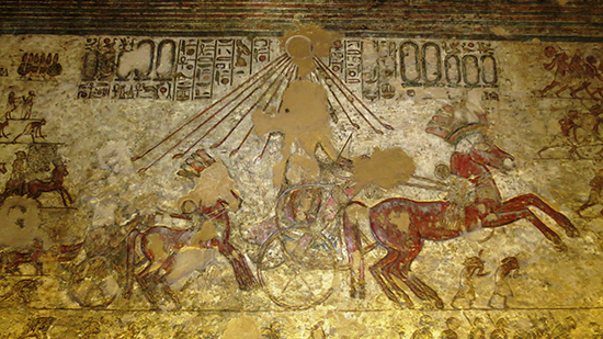 Painted wall relief of horse and chariot.  