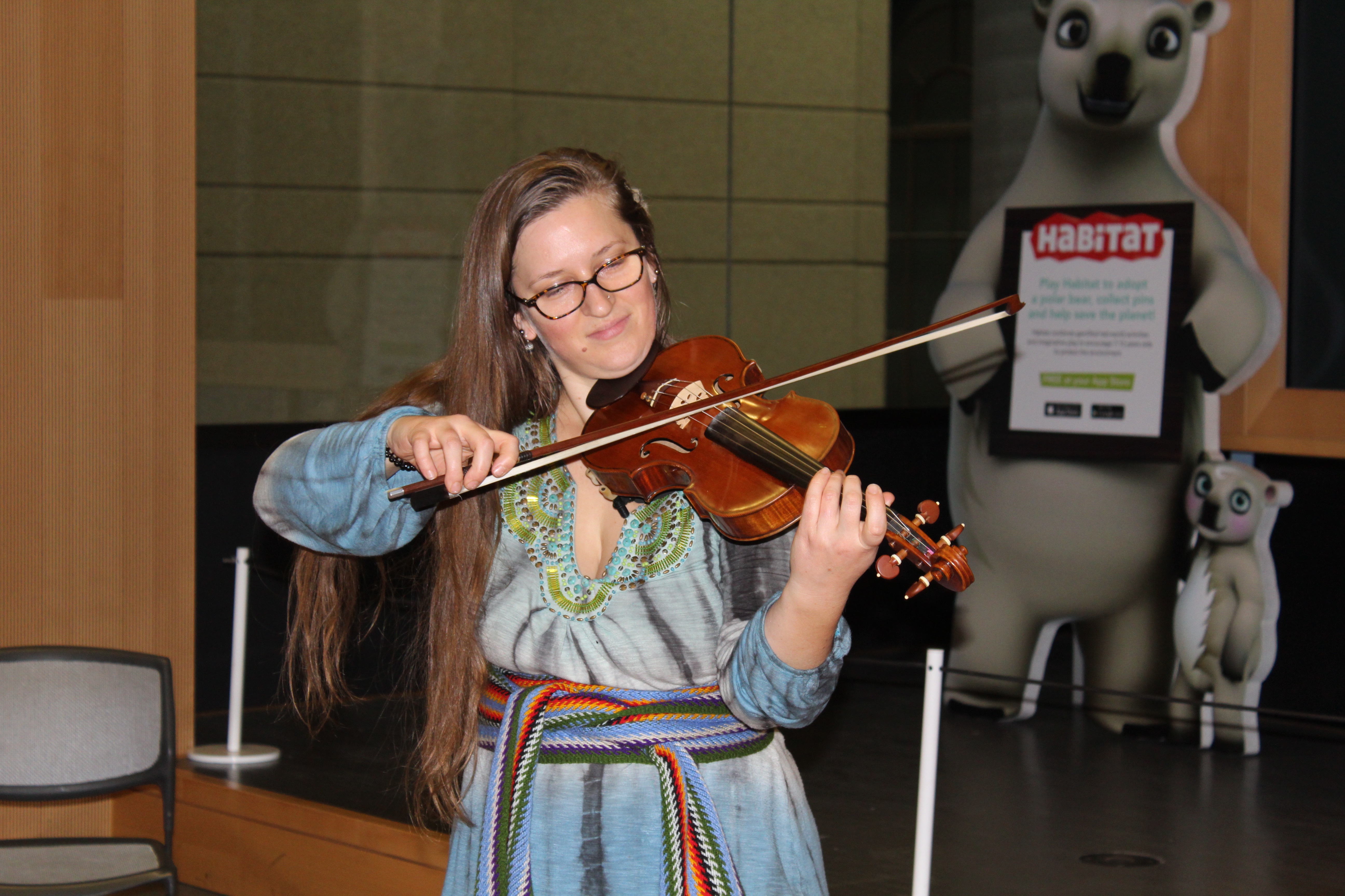 A woman playing the fiddle