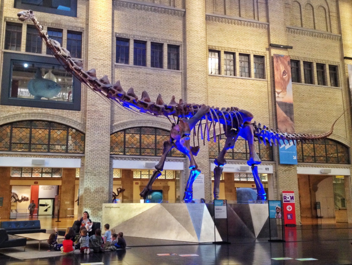 Family gathered under the dinosaur at the Royal Ontario Museum.