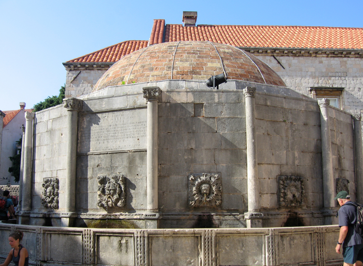 A stone fountain surmounted by a dome.