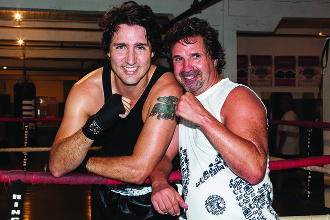 Picture of Justin Trudeau in boxing gear his raven tattoo displayed on his arm