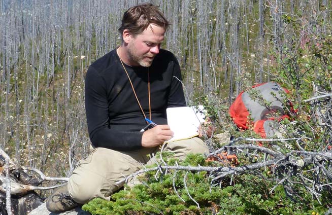 Robert Gaines from Pomona College taking geological notes in the field